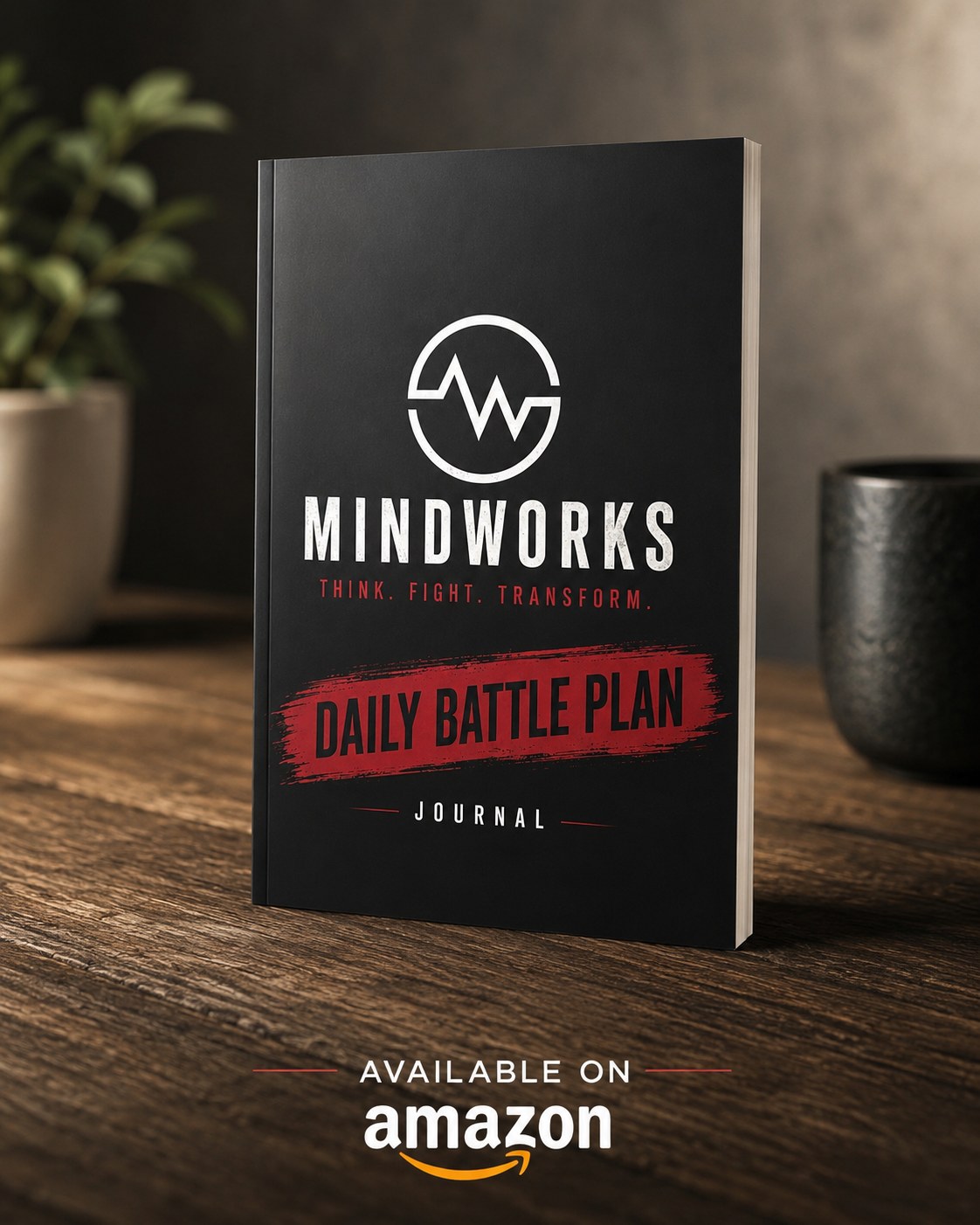 MindWorks Daily Battle Plan Journal — paperback on a wooden desk